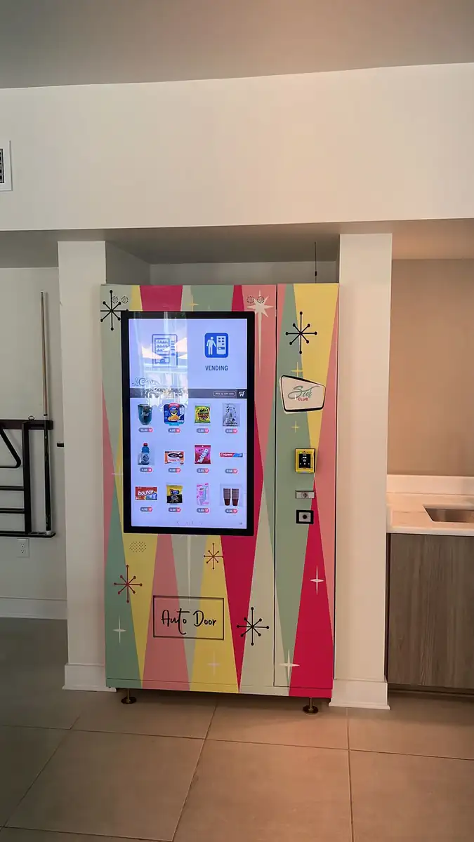 DMVI smart vending machine with touchscreen display in public retail deployment