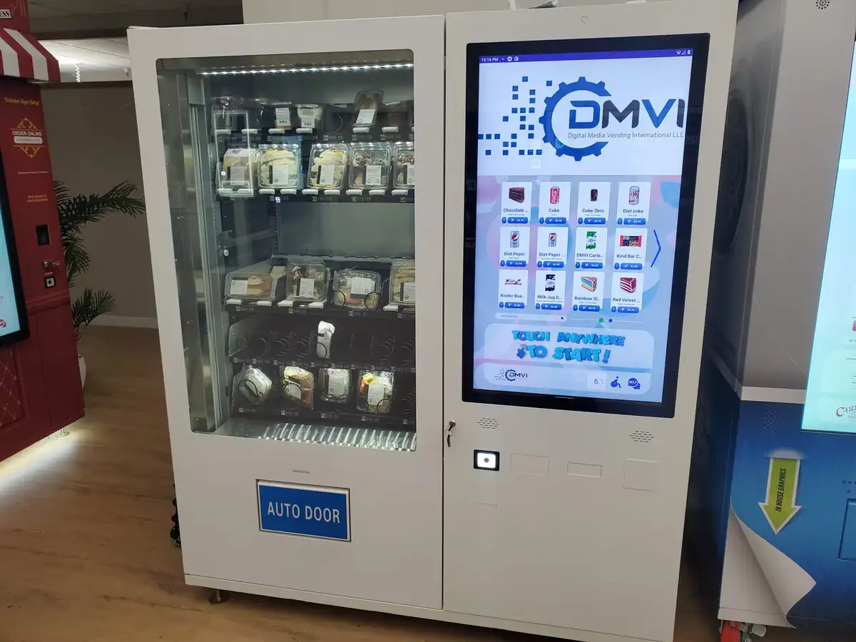 DMVI smart vending machine with touchscreen display in public retail deployment